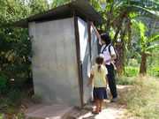 	A specialist checking the latrine in a community