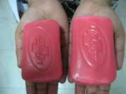 Two bars of soap that are outwardly similar - the original, and a copy with an embedded motion sensor.
