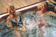 An older couple relaxing in a hot tub