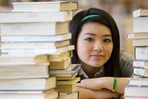 young Asian femal with books