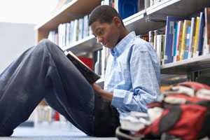 	young African American male in reading library