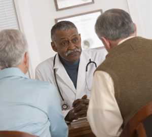 Image of a doctor speaking with patients