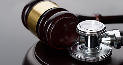 	photo of a stethescope and gavel