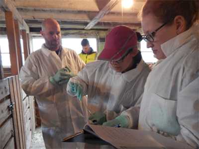LLS fellow works with local investigation team to obtain E.coli samples.