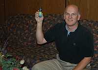 Tom Miller showing the homeopathic product that failed to protect him from malaria.(Courtesy Tom Miller.)