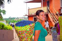 Kelly Granger in Ghana with her djembe, a traditional Ghanian drum made from carved wood and goatskin.
