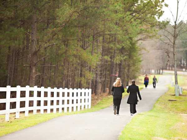 Residents of Granville County in rural North Carolina walk on one of several walking trails developed through the Granville Greenways Master Plan initiative. The plan includes walking trails between schools, worksites, shopping areas and neighborhoods. Using the recommendations of the Task Force, the county created a plan to build more walkable communities to reduce obesity and promote active lifestyles. 