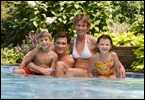 A family in a swimming pool