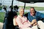 Elderly couple on a golf cart