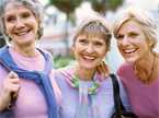 Three elderly women smiling