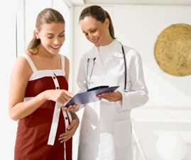 Pregnant woman talking to a doctor