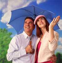 Man and woman under  an umbrella