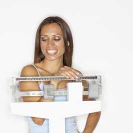 Photo: Woman on a weight scale