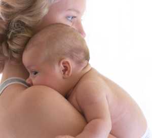 Photo: Mother holding her infant
