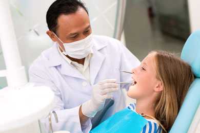 Dentist with his patient