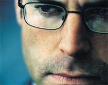 Close up of a man wearing glasses
