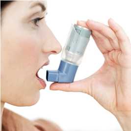 Photo: Woman using an inhaler