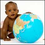 A baby plays with a ball in the style of a globe