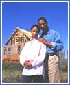 Photo: African American couple outside their house