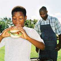 Boy eating a hamburger