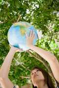 Woman holding World globe