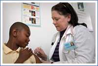 Photo: teen receiving a vaccination.
