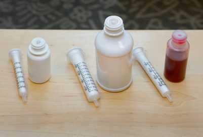 medicine bottles with flow restrictors