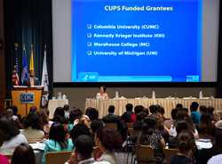 	Julio Dicent-Taillepierre, providing students with background on the CDC Undergraduate Public Health Scholars Program (CUPS). Also pictured: Sam Gerber, CUPS Project Officer. Photo Credit: James Gathany, CDC.