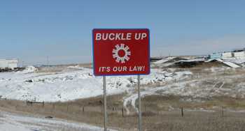 	Photo: road sign: Buckle up - its our law