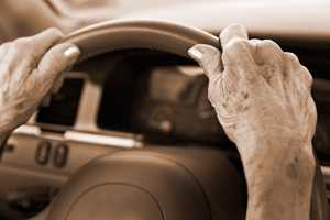 Photo: older woman's hands on steering wheel
