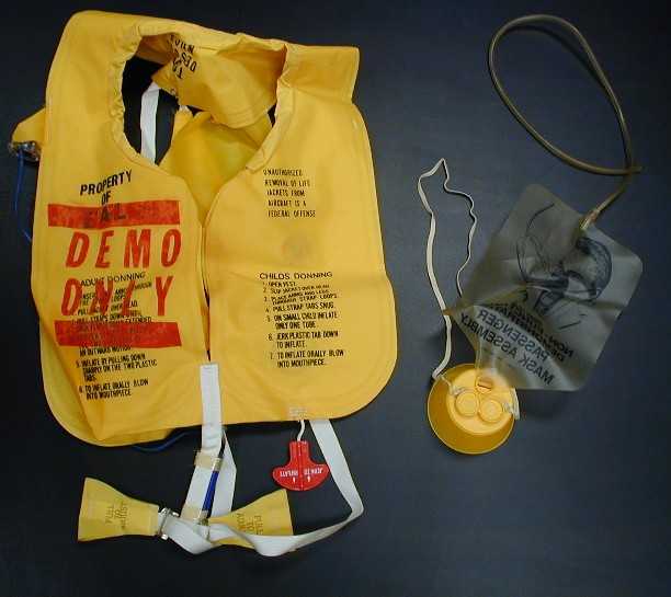 This bright yellow life vest and oxygen mask are souvenirs from the “Red Spots” Epi-Aid. Donated by Kathy Rauch, 1995, 1995.136.1, CDCM Collection  