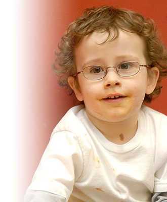 A boy wearing glasses