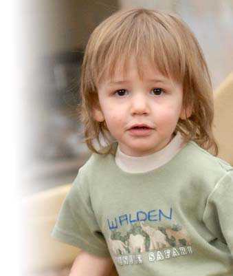 A toddler boy in a t-shirt