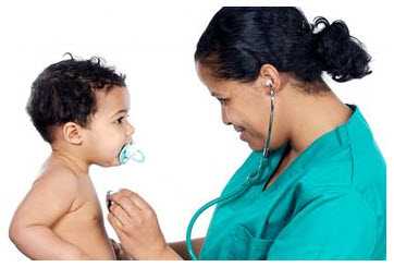 	Photo: Doctor examining a child