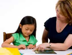 Photo: child working with adult