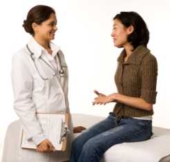 Woman discussing issues with physician