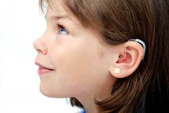 girl with hearing aid
