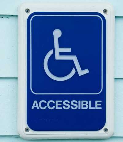 Accessible street sign with wheelchair logo