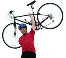 Man holding a bike above his head