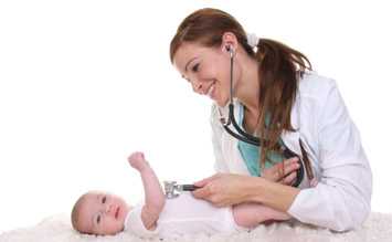 Doctor examining an infant