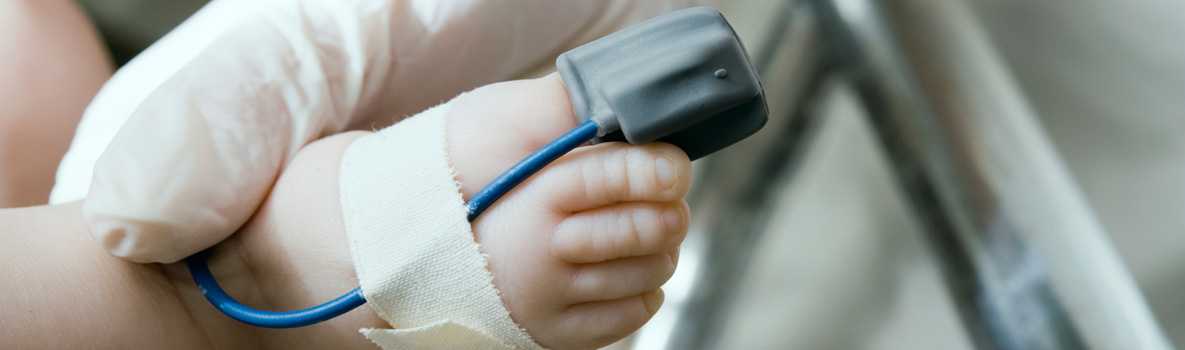 Infant with pulse oxymeter