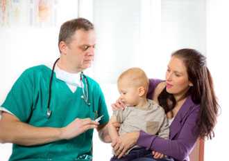 Doctor giving infant shot