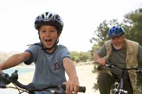 Grandson and grandfather bicycling