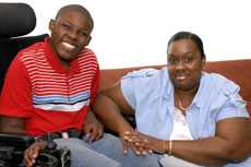 Boy in wheelchair and mother