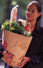 Woman holding bag of groceries