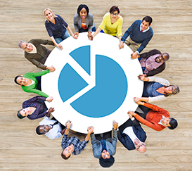 Photo of a people at a circular table with a graph in the middle.