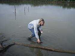 Nancy Fleischer, PhD (EIS ’10) collecting a water sample in Alaska