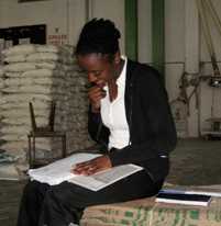 Epidemiologist Johnni Daniels reviews data from tests in a Kenya maize processing plant. 