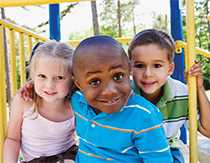 Smiling children on a playset