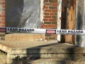 "Danger: Lead Hazard" tape stretched across a work area